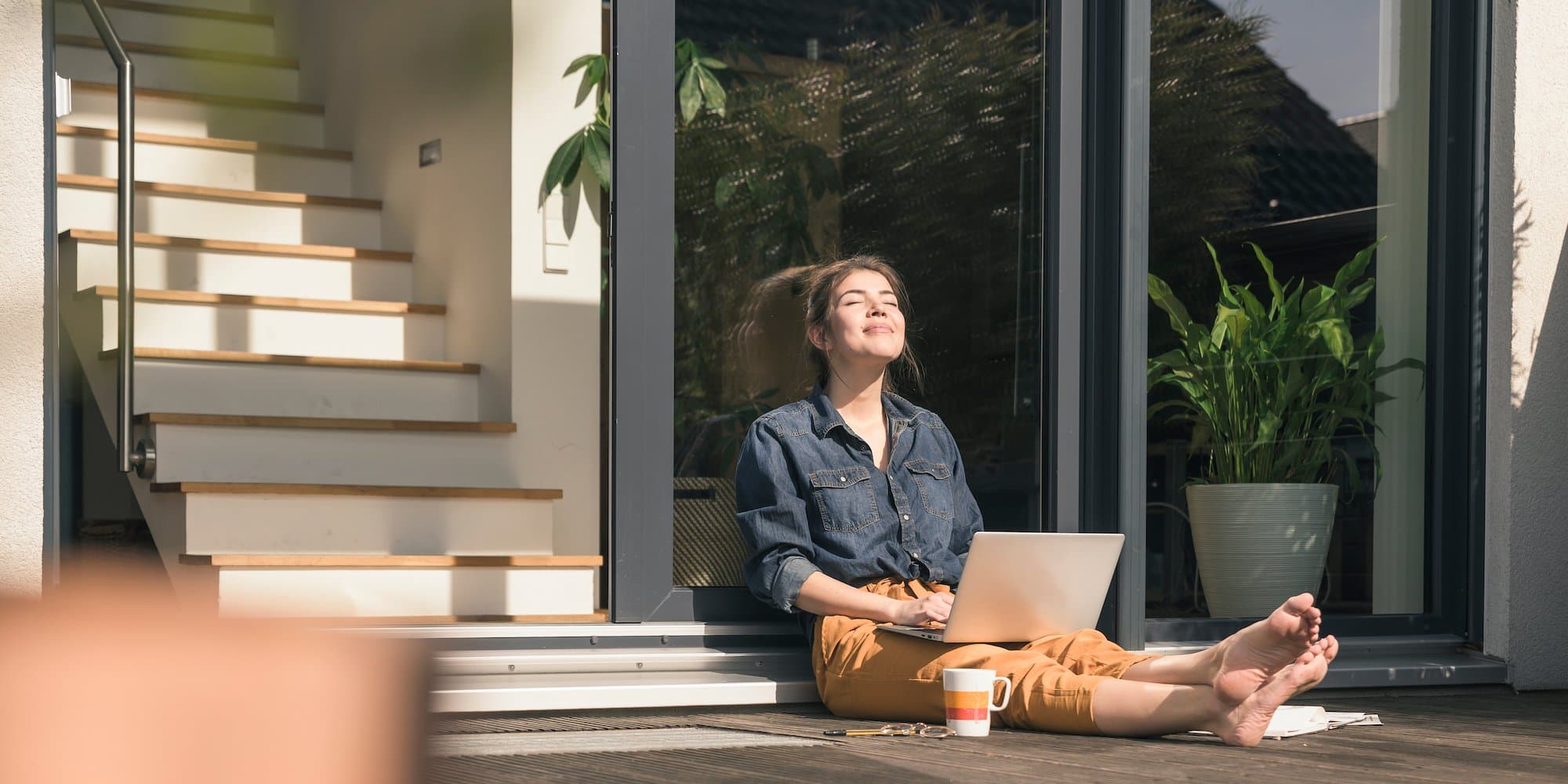 person sitting outside working on laptop
