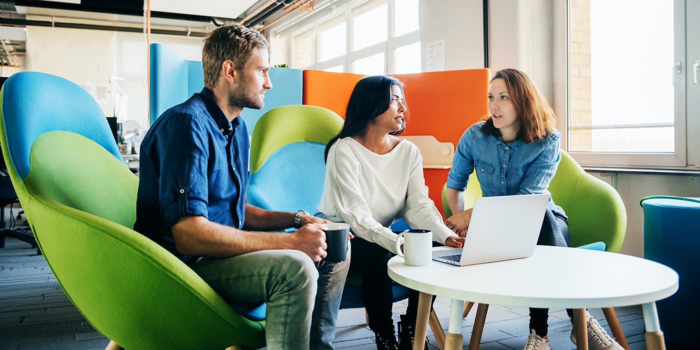three people meeting in an office