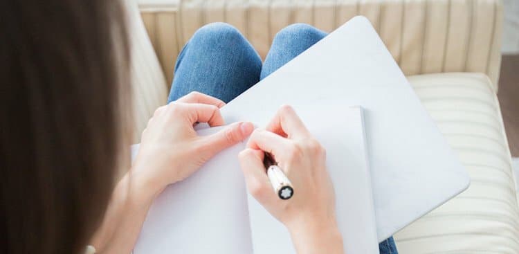 person writing interview thank you note