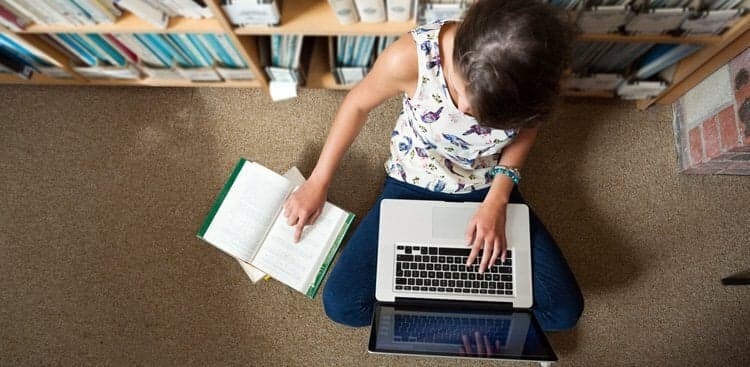 student in library