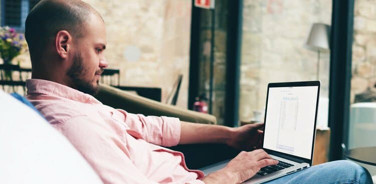 man sending email