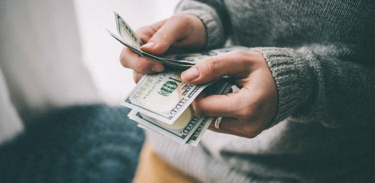 man counting money