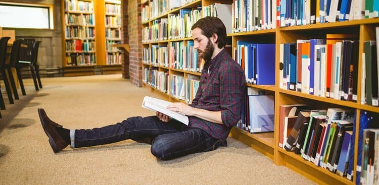 student reading in library
