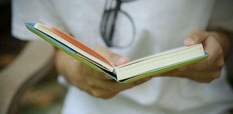 woman holding book
