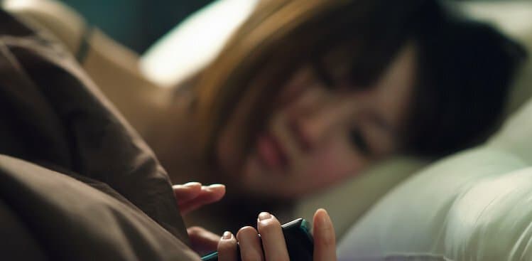 person in bed