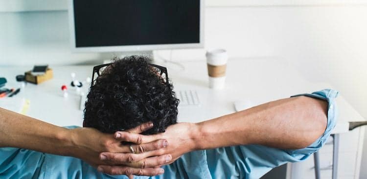 person relaxed at desk