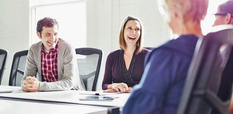 photo of co workers in meeting
