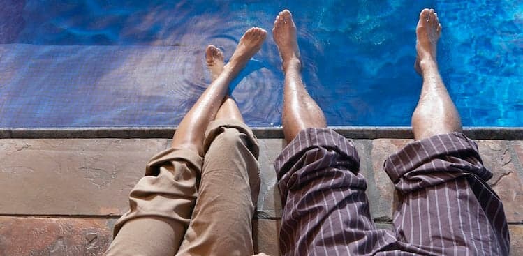 people sitting by the pool