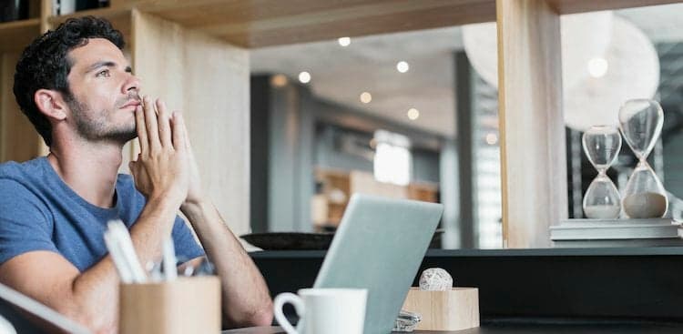 photo of man on laptop