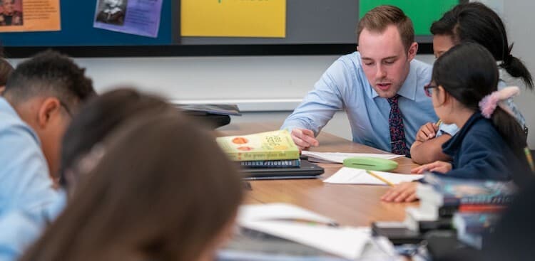 Joey Patterson, a teacher at Success Academy, with students
