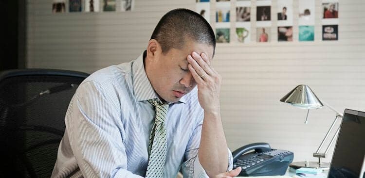 person stressed out at desk