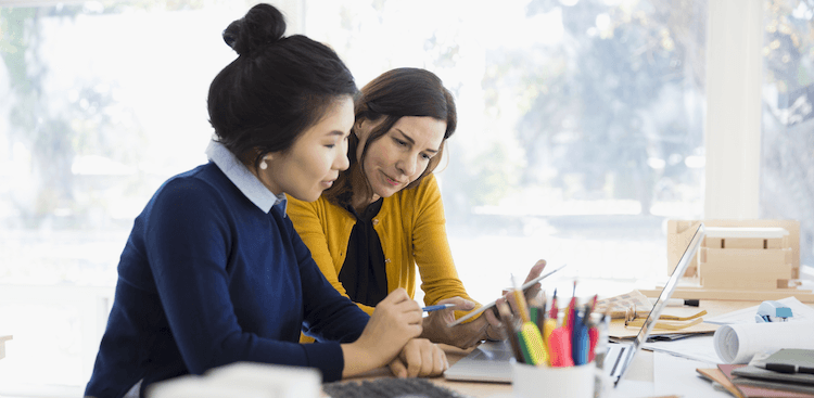 two people working together