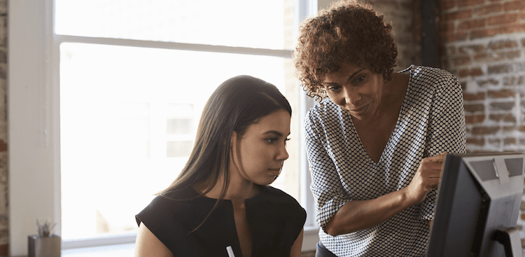 someone mentoring a younger colleague