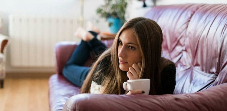 person thinking on couch