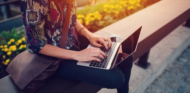 person working on laptop outside
