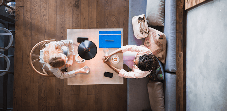 two people meeting for an informational interview over coffee