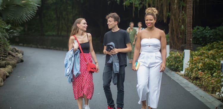 Sophie Pinto-Raetz, a success coach at Expensify, walking with co-workers in Vietnam