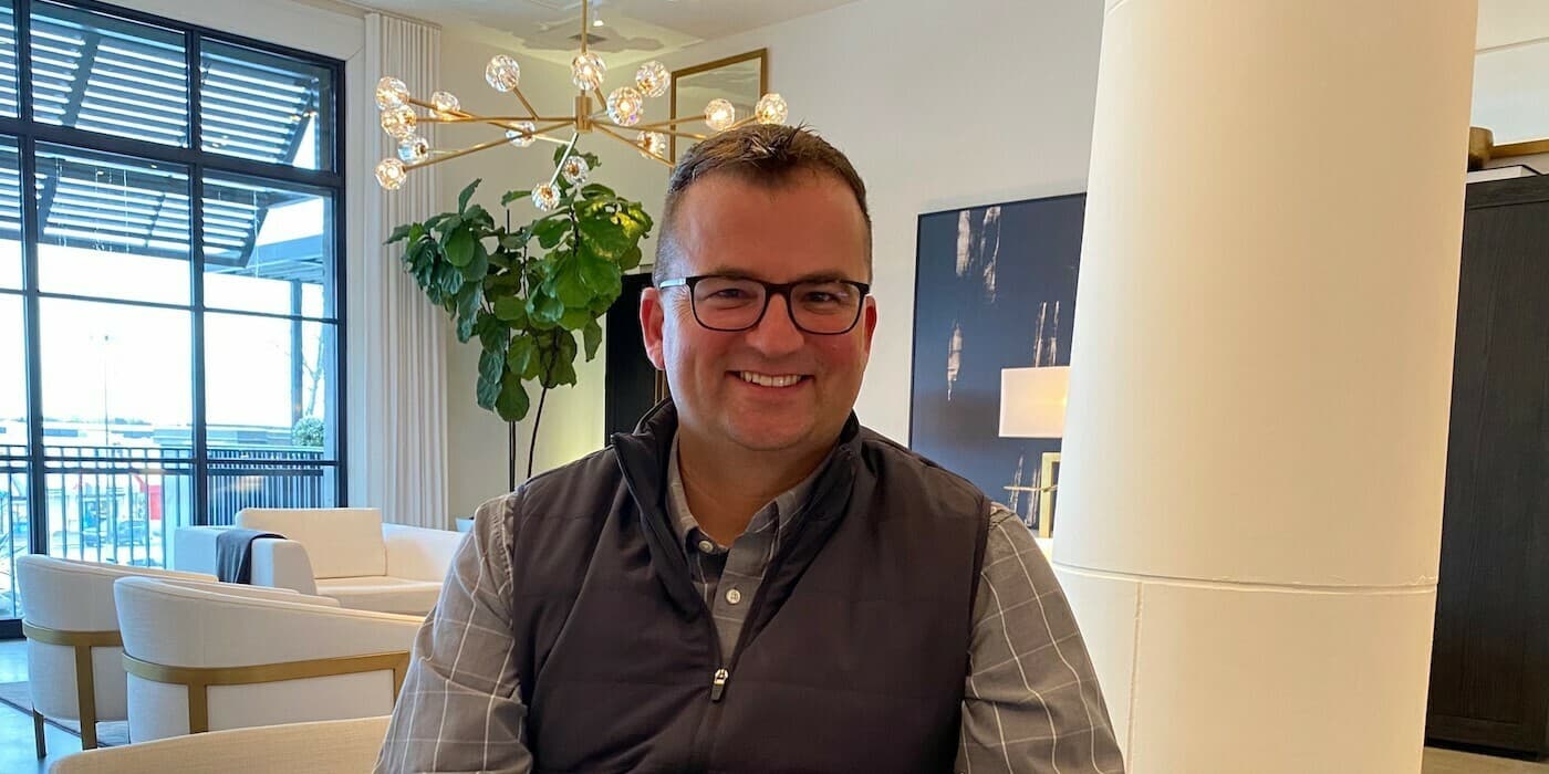 smiling person wearing glasses
