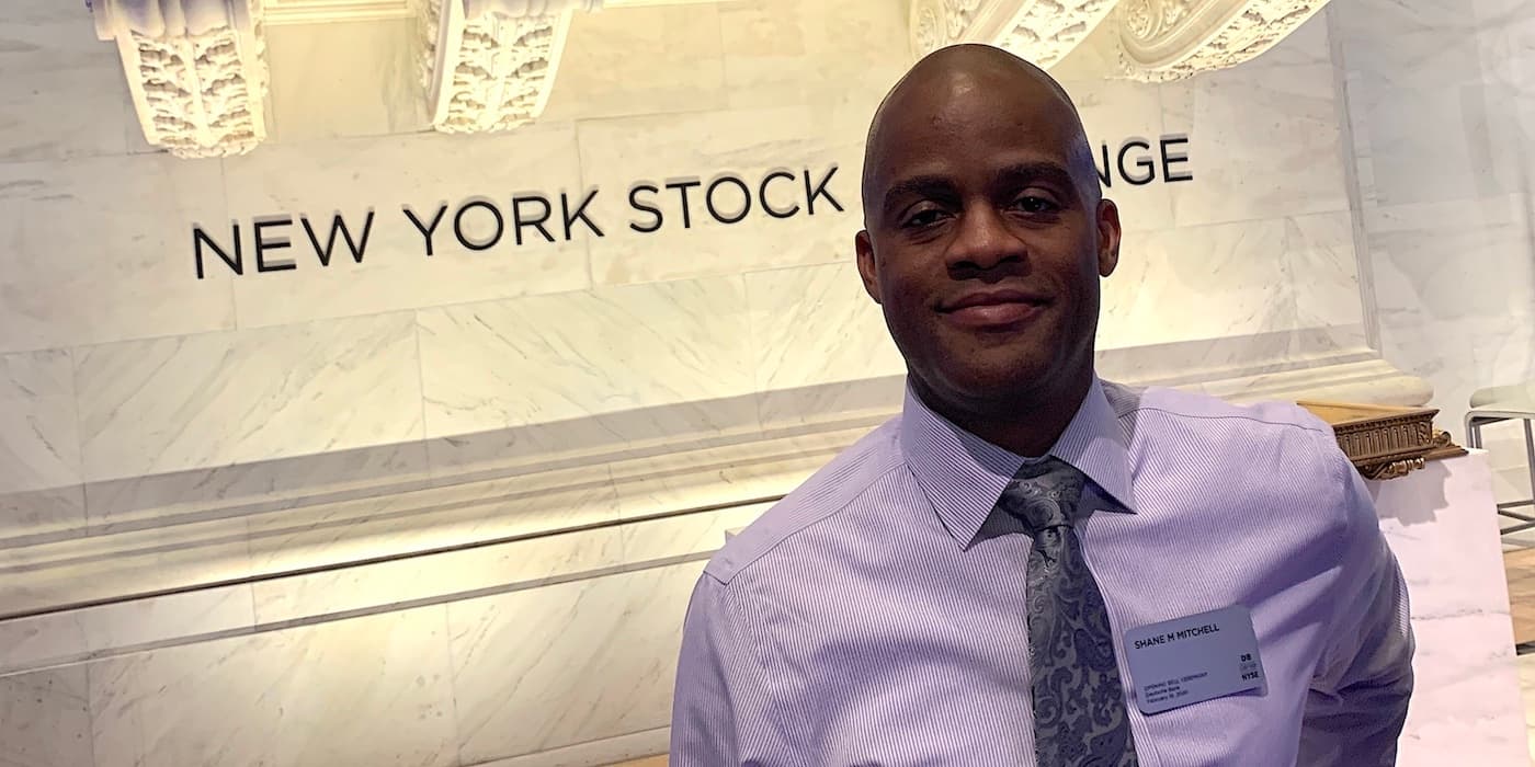 person standing inside of the New York Stock Exchange