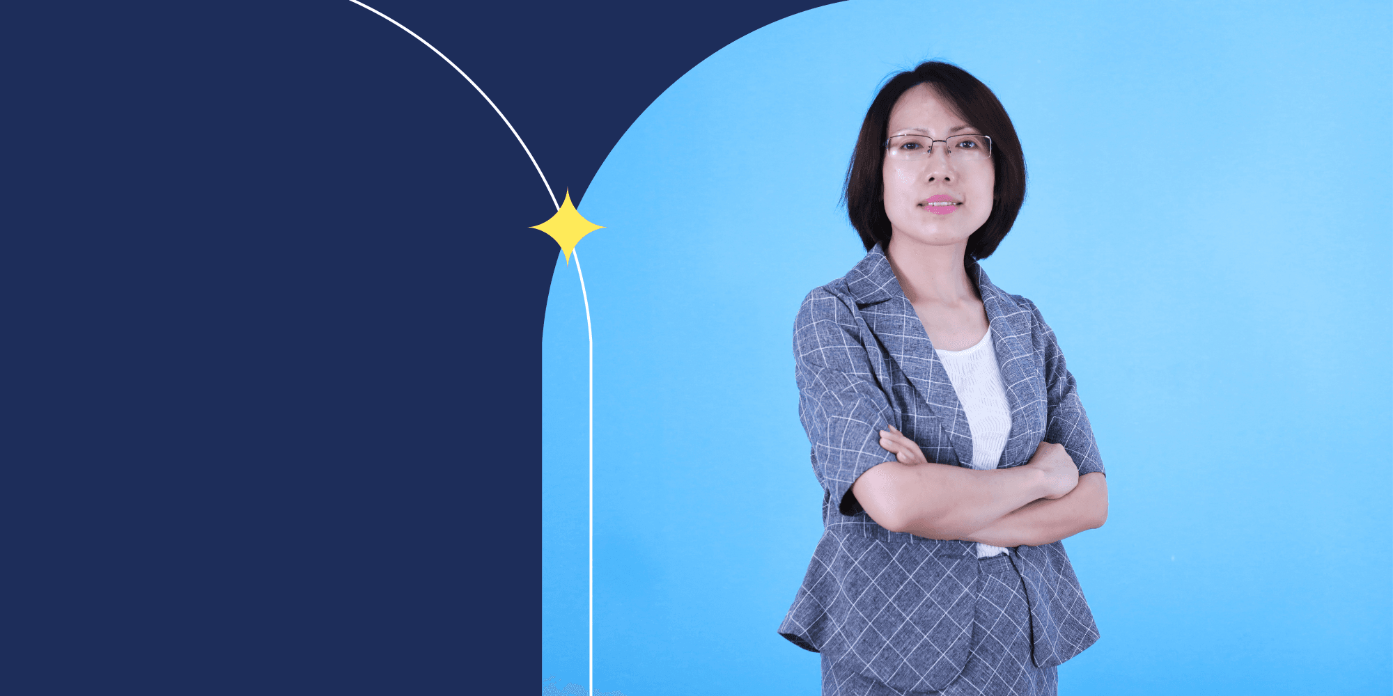 A person facing the camera with their arms crossed. They have ear-length black hair. They're wearing a blazer, white shirt, and matching skirt.