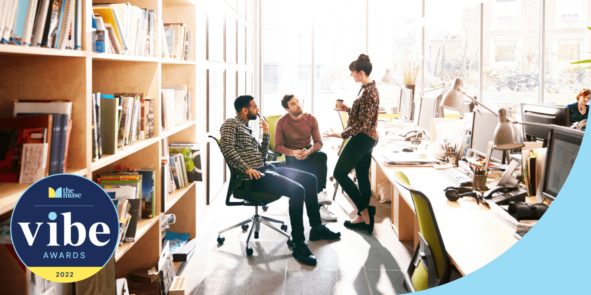 three coworkers chatting in an office