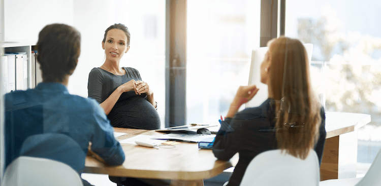 pregnant person speaking at the office