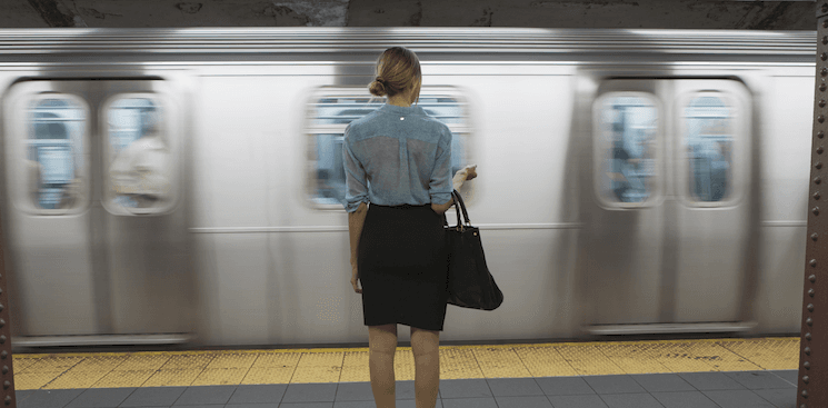 person standing on a subway platform