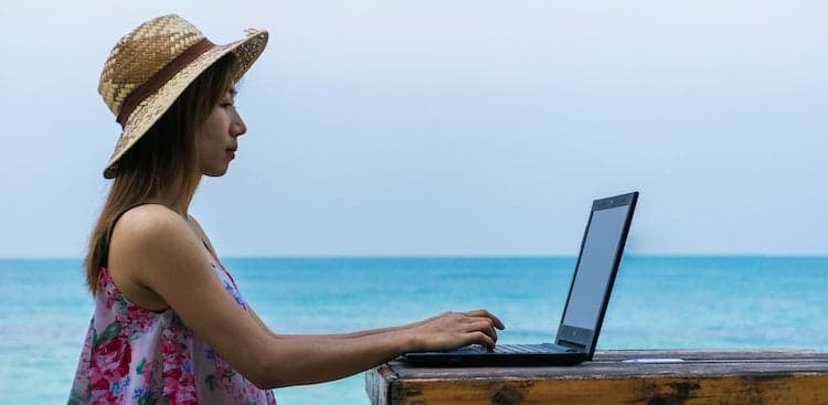person on laptop outside