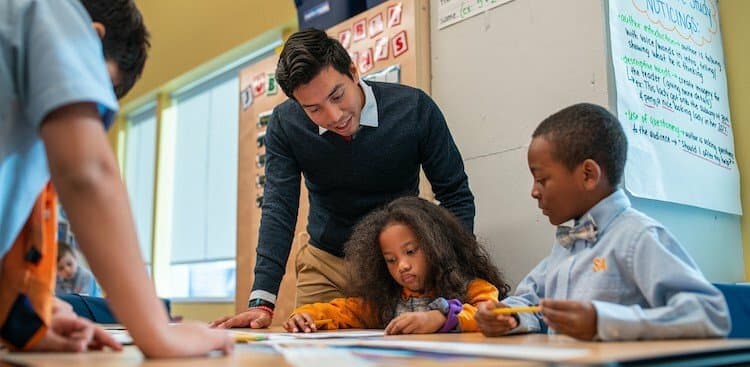 a teacher and children inside of a Success Academy classroom