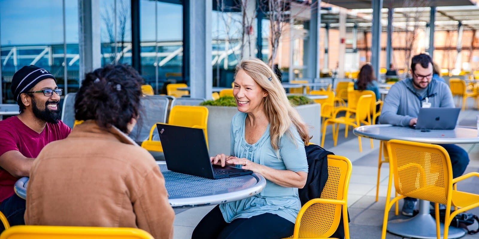 employees working in an outdoor courtyard