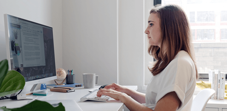 person typing on computer